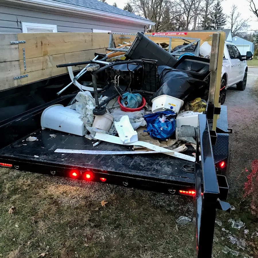 Roll-off dumpster delivered to a residential driveway in Utica